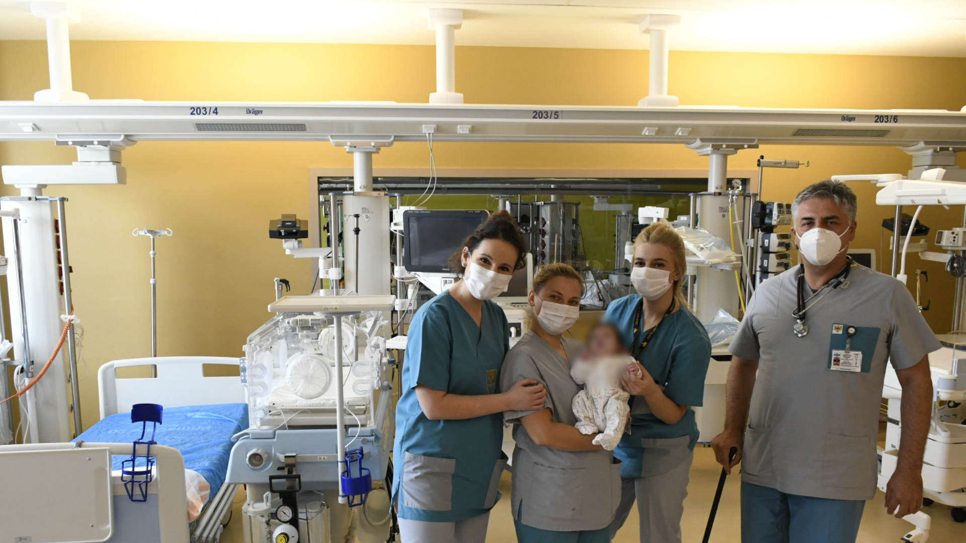 Following a complicated surgery, a little patient goes home in the arms of his parents